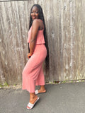 side view everyday jumpsuit for ladies that love comfort in the color coral